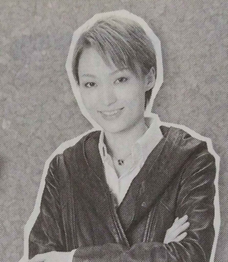 Nozomi Fuuto looking into the camera with her arms crossed.